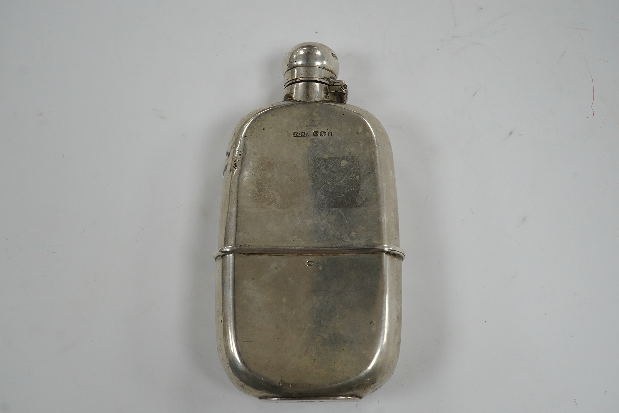 A late Victorian silver hip flask, by James Dixon & Sons, Sheffield, 13.3cm, 5.3oz. Condition - poor